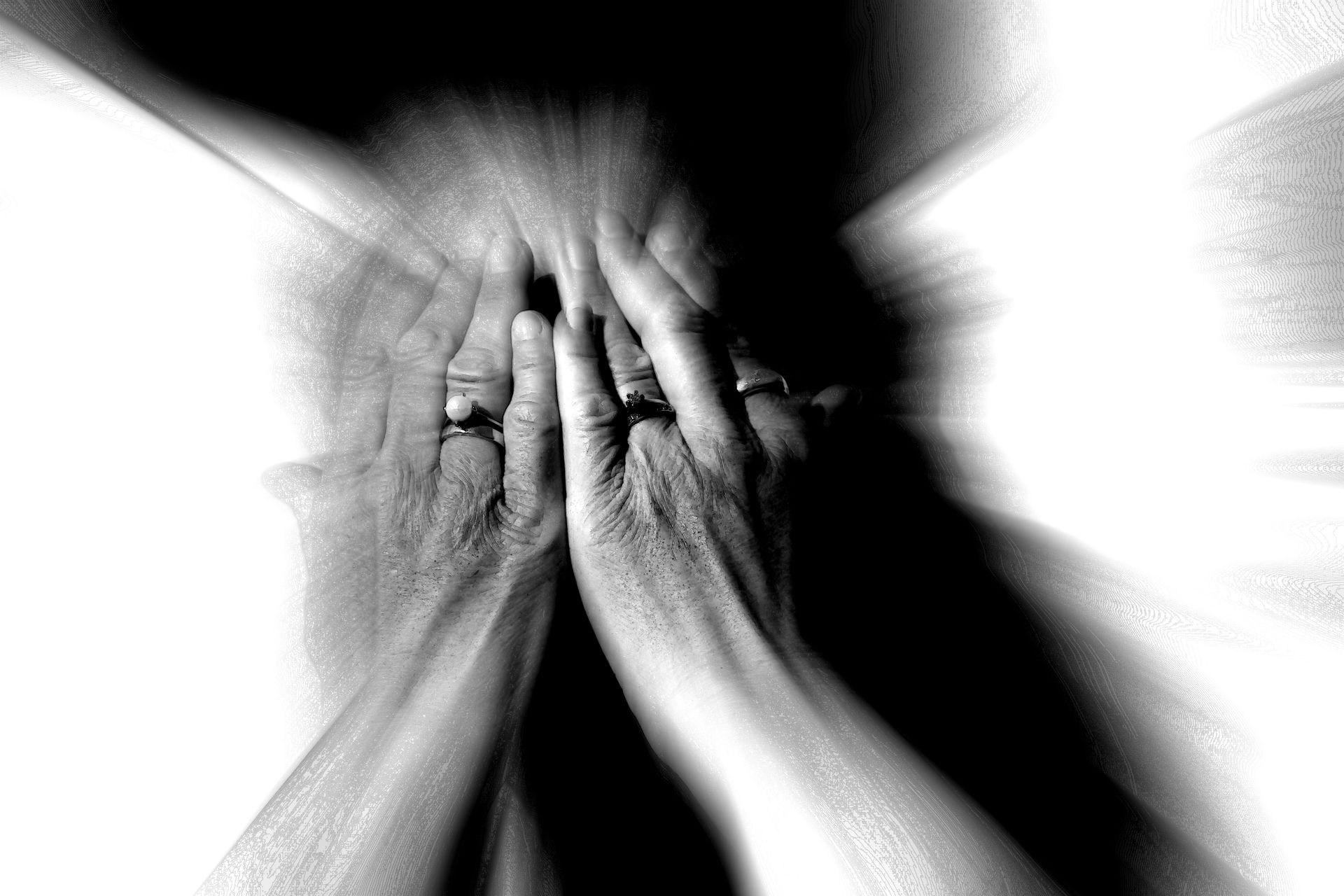 Close up portrait of woman covering her face with hands blurred background. Sex concept. Black and white photo. Rape and sexual abuse. Stop violence against women, concept photo of Sexual assault.
