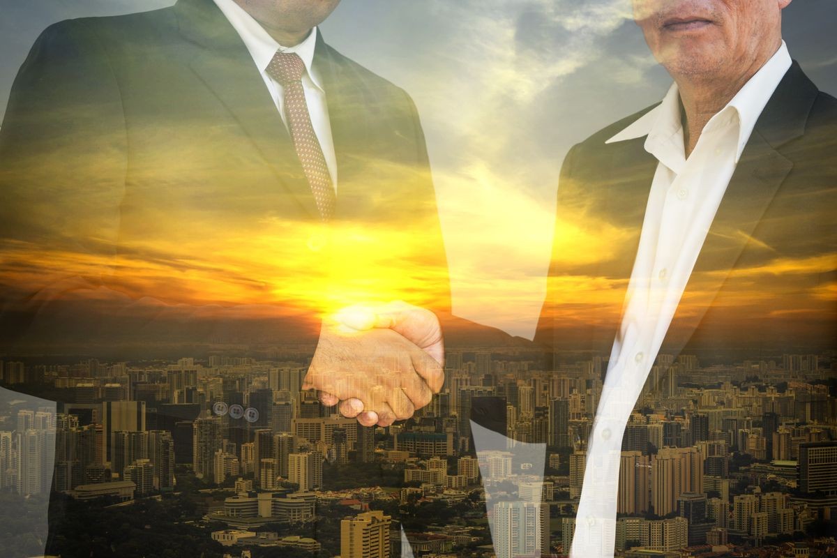 double exposure of 2 businessman shaking hand for commitment and cityscape - can use to display or montage on product